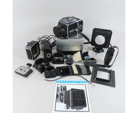 A Hasselblad 500 C/M camera, with Carl Zeiss lens no.5654881, with accessories