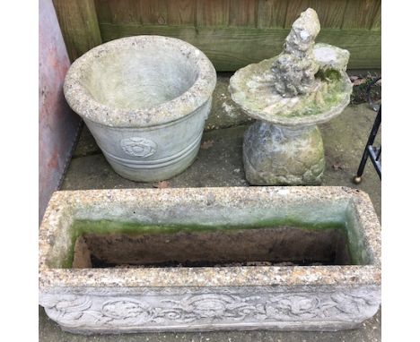 A reconstituted stone trough, together with a bird bath and a planter 