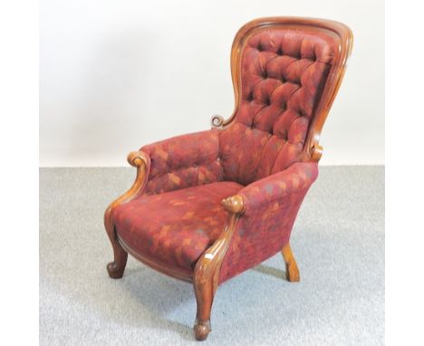 A Victorian red upholstered show frame button back armchair 