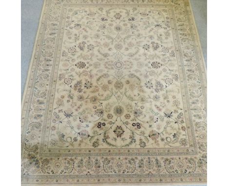 A Chinese woollen carpet, with floral designs on a cream ground, 297 x 235cm