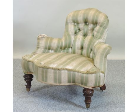 A Victorian green upholstered button back corner chair, on turned legs