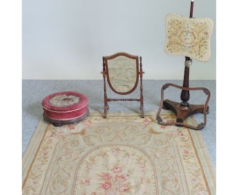 A Victorian footstool, together with a mahogany shield shaped toiletry mirror, an embroidered pole screen and a tapestry wall