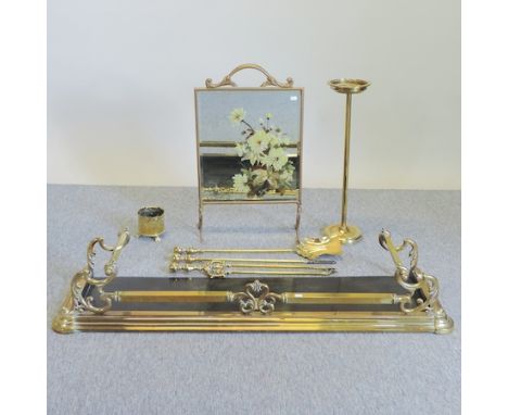 A brass fender, 131cm, together with a fire screen, fire tools, a brass pot and a brass stand 
