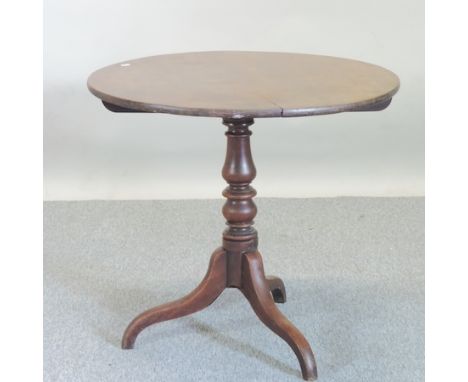 A 19th century oak occasional table, with a circular tilt-top, on a tripod base, 82cm