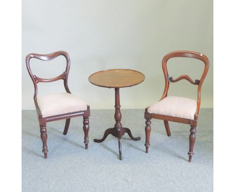 A 19th century mahogany tripod table, together with a near pair of Victorian balloon back chairs