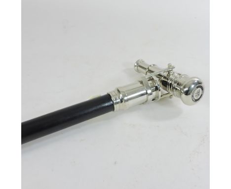 A walking stick, containing an extendable telescope 