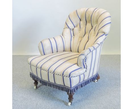 A Victorian striped upholstered button back armchair, the leg stamped G.A.S. 9022