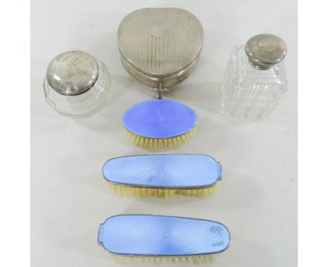 A set of early 20th century guilloche enamel and silver backed dressing brushes, together with a silver trinket box and dress