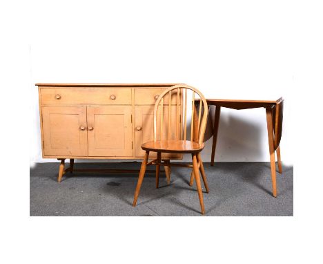 An Ercol light elm and beech dining room suite, comprising a sideboard, model 351, fitted with one short and one long drawer 