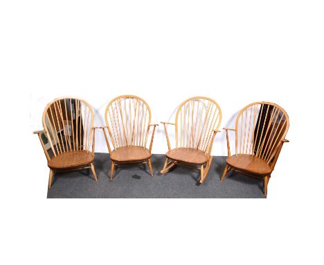 Three Ercol armchairs and similar rocking chair, spindle backs, lacking seat pads, width 74cm.