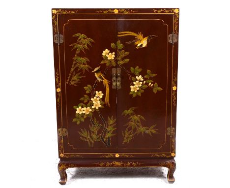 A Chinese brown lacquered side cabinet, painted decoration of exotic birds, and flowering foliage, two doors enclosing two sh