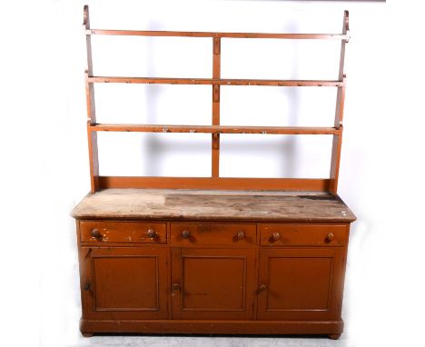 A Victorian painted pine dresser, matched three-shelf rack, base with three drawers over three panelled doors, width 185cm,de