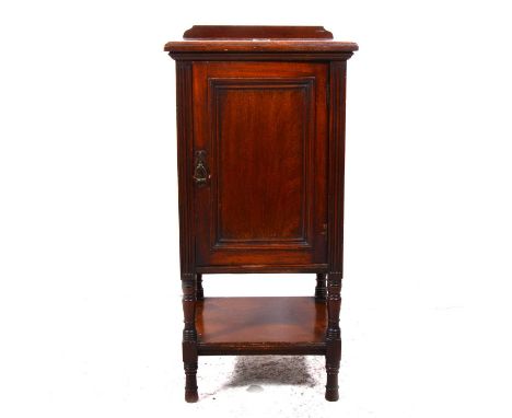 An Edwardian mahogany bedside table, panelled door, shelf under, width 40cm, depth 36cm, height 82cm.