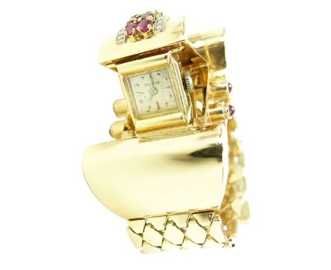 Nice Quality Retro 1940's 14 Karat Pink Gold, Ruby and Diamond Swiss Watch. Oversized. The diamonds of E-F color and VS1-VS2 