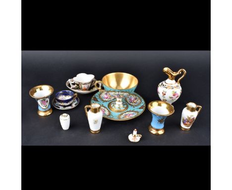 Grouping of Ten (10) Vintage Limoges Porcelain Tableware. Includes a cup and saucers along with several miniature vase and pi