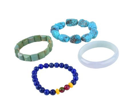 Four Chinese Hardstone Bracelets. Includes jade bangle 2-1/4" interior width 36.41 grams, carved turquoise 2-1/2" interior 60