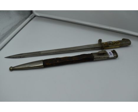 A German WW2 period Police Dagger and scabbard by Paul Weyersberg &amp; Co Solingen, scabbard metal and leather, dagger handl