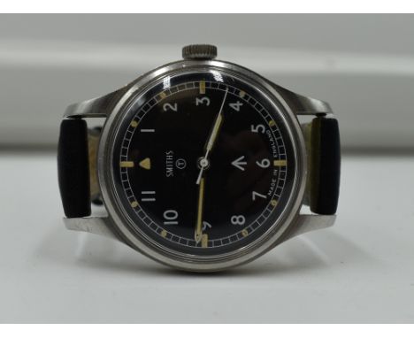 A Smiths Military Steele Wrist Watch having black face and Military Arrow Made In England, on reverse W10/6645-99-961-4045 17