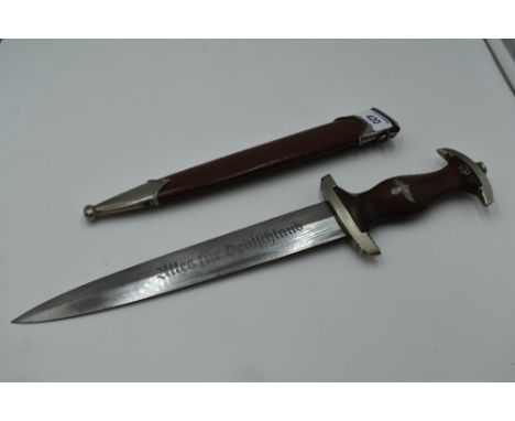 A German SA Service Dagger c1933 with metal scabbard, grip with National Socialist Emblem and SA Emblem, blade marked Alles F