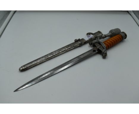 A German Army Officers Dagger c1935 with metal scabbard and silver wire portepee knot, plastic grip handle, blade unmarked,