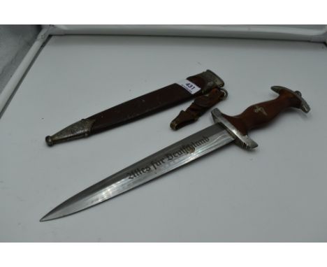 A German SA Service Dagger c1933 with metal scabbard, grip with National Socialist Emblem and SA Emblem, blade marked Alles F