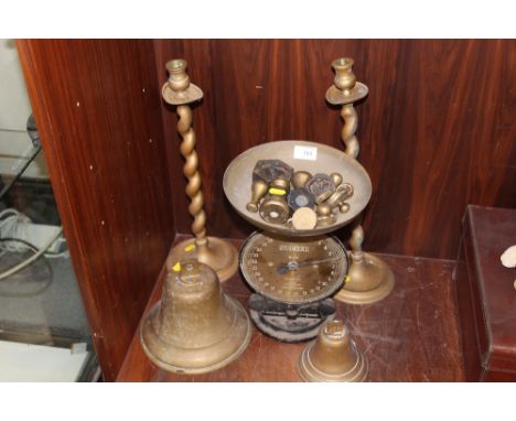 A LARGE VINTAGE BRASS BELL, TOGETHER WITH ANOTHER, BRASS BARLEY TWIST CANDLESTICKS AND A SET OF SCALES WITH WEIGHTS  
