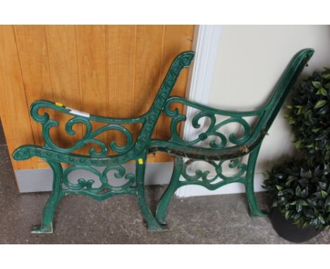 TWO CAST PAINTED GREEN BENCH ENDS