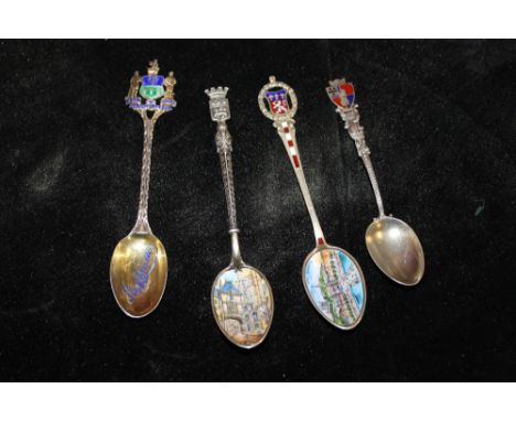 FOUR SILVER AND ENAMEL TEASPOONS