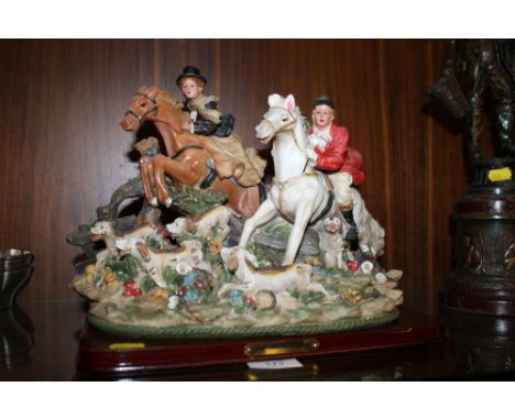 A TABLEAU OF A HUNTING SCENE IN RESIN