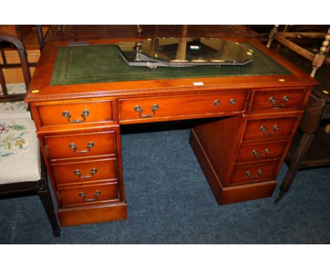 A YEW WOOD TWIN PEDESTAL DESK WITH INSET LEATHER TOP