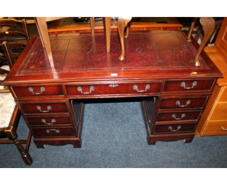 A REPRODUCTION MAHOGANY TWIN PEDESTAL DESK WITH LEATHER TOP