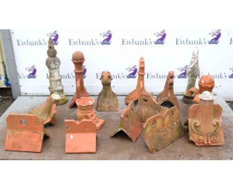 Collection of Terracotta items to include roof finials, and a planter in form of a skull (15)        