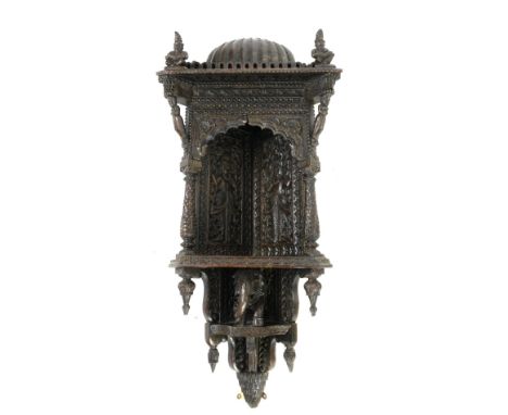 Anglo-Indian carved hardwood wall hanging corner shelf, with domed top above caryatid and Corinthian columns, with elephant t