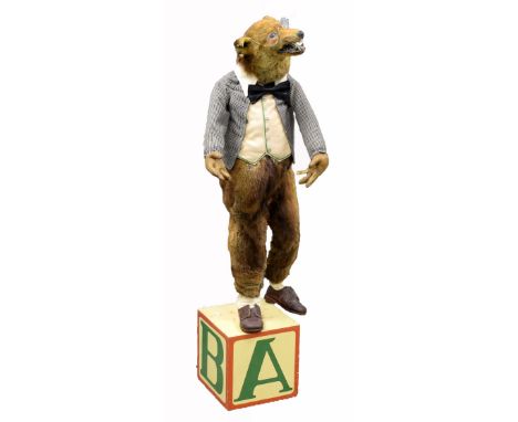 Taxidermy automaton of a Fox in clothes standing atop a box painted with letters, H.112cm       PAT Tested. Does currently wo