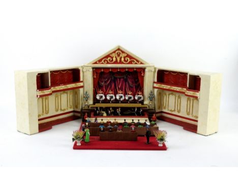 Model Theatre items to include a stage and audience members and a model grandfather clock        Theatre - height 30.5cm widt
