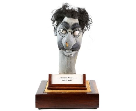 A Spitting Image head puppet of Groucho Marx, from the British satirical puppet TV show Spitting Image, a painted latex head 
