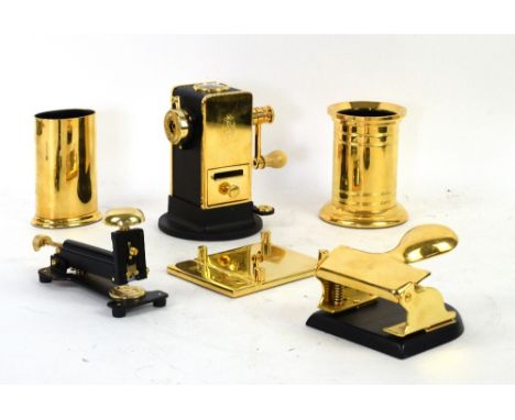 A collection of El Casco desk accessories to include hole punch, pencil sharpener, desk stapler and others (9)       