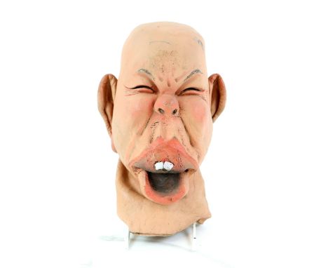 A Spitting Image head puppet of Princess Beatrice, from the British satirical puppet TV show Spitting Image, a painted latex 