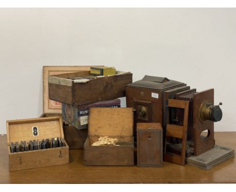 A late Victorian brass mounted mahogany "challenge" magic lantern by J Lizars, with ivorine makers badge, together with a col