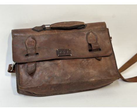 A leather light brown satchel with J.L.S initialled patch sewn to the front, with silver hardware and ivory/cream stitching a