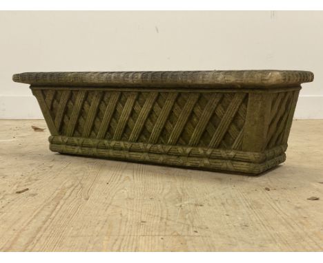 A reconstituted stone trough shaped planted with lattice design. L88cm, D31cm, H28cm