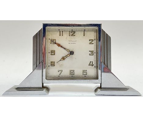An Art Deco chrome plated clock with 8 Day movement, retailed by Brook and Son of Edinburgh, the dial with Arabic numerals ma