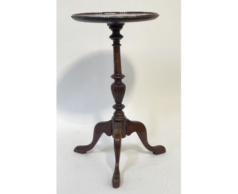 A Georgian style mahogany tripod wine table, the circular top raised on a turned column and triple splay supports. H51cm.&nbs