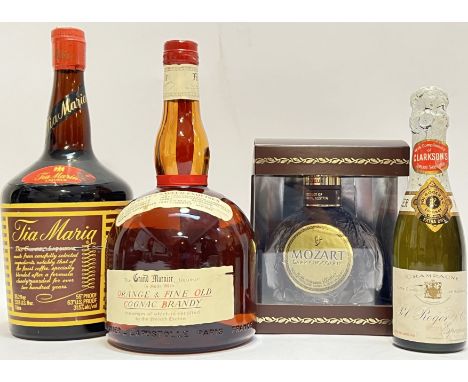 A mixed group of liquor comprising a 1 litre bottle of Tia Maria Liqueur, a Grand Marnier Orange and Fine Old Cognac Brandy (