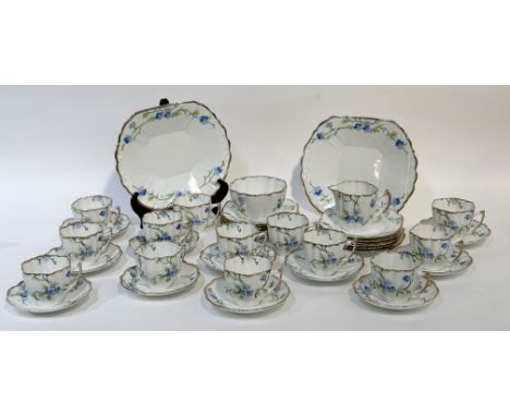 A Melba bone China part tea service&nbsp; decoration with Forget-me-not's with gilt edging, comprising, a sugar bowl (h-6.5cm