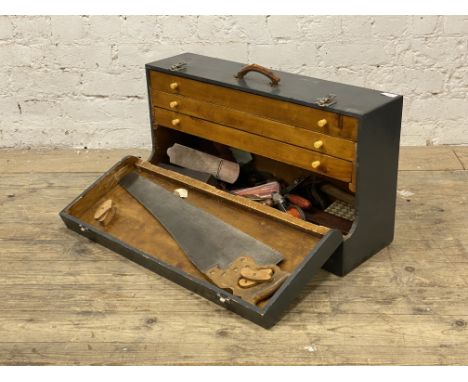 A gray painted joiners tool box with collection of woodworking tools. H42cm, L77cm.&nbsp;