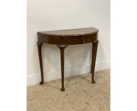 A Georgian style mahogany demi-lune console table, fitted with a single drawer and raised on turned and tapered supports with