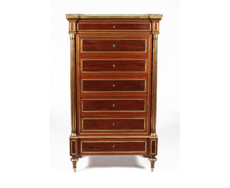 A French Directoire mahogany and gilt brass mounted secretaire abbatant, circa 1815, the grey veined marble inset top within 