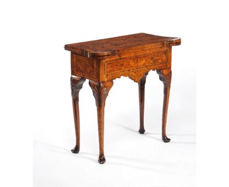 A Dutch walnut and marquetry folding card table, second half 18th century, decorated with floral and foliate marquetry throug