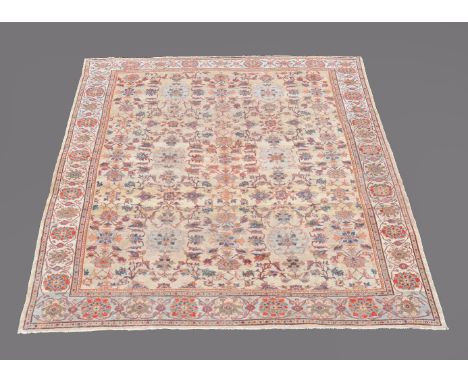 A Mahal carpet, the cream field decorated with and overall design of floral branches in shades of red, ochre and navy, approx